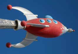 photo of gray and red spaceship building